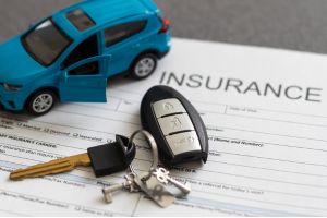 Car keys on top of an affordable car insurance plan, for a Fort Mill, SC driver