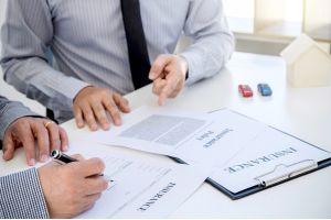 Homeowner in Gastonia, NC signing up for Homeowners Insurance with an agent